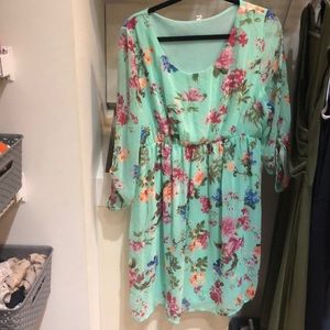 Maternity dress. Floral and around knee length.